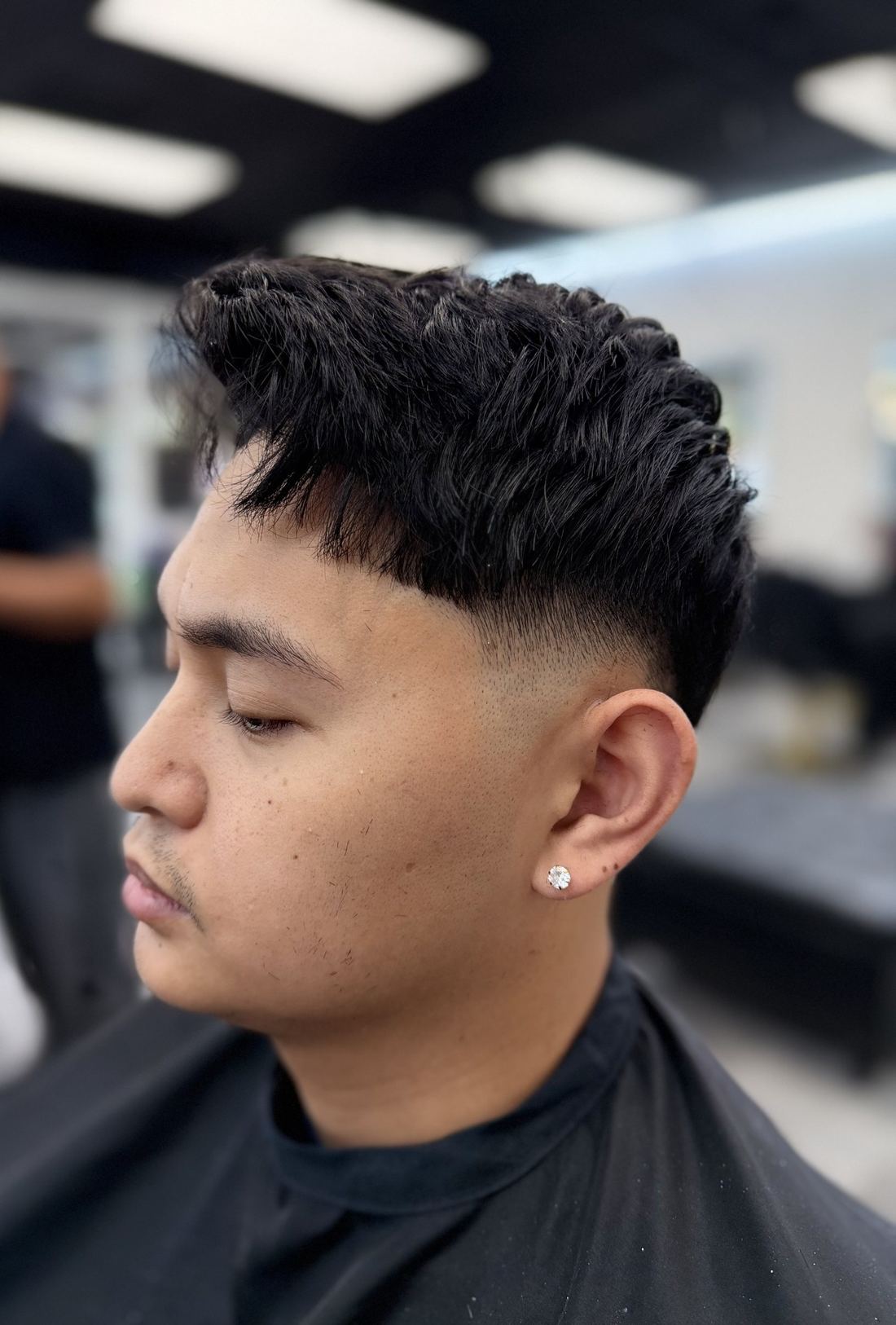 Textured fringe crop with a mid skin fade